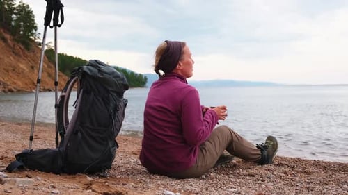 Hiking Tourism Adventure Backpacker Woman Resting After Hiking Looking at Beautiful View Hiker Girl