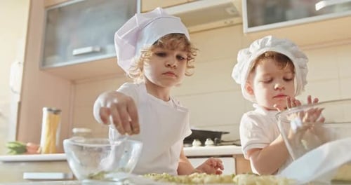 Tiny Bakers at Work Preparing Homemade Treats in the Kitchen