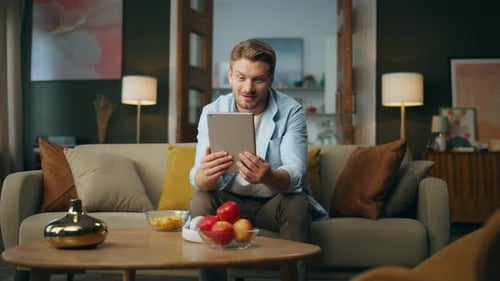 Cheerful Guy Talking Pad At Home Place. Smiling Positive Freelancer Having Video Chat Looking At ...