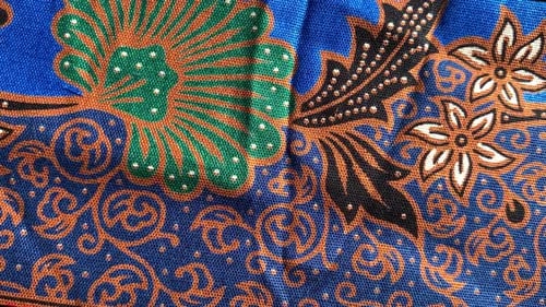Vibrant Fabric Design with Botanical and Swirl Motifs
