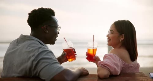 Couple, toast and love on beach with relax on bench for ocean waves, commitment