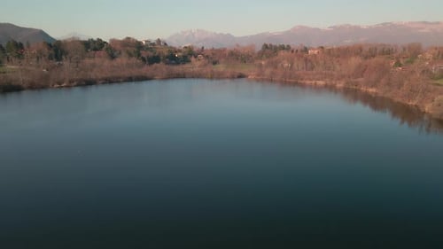 Scenic View Of Country Lake With Calm Blue Water Immersed In The Nature Of The Woods With Mountains