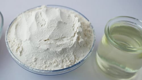 Baking Ingredients Close Up: Flour, Eggs, and Oil