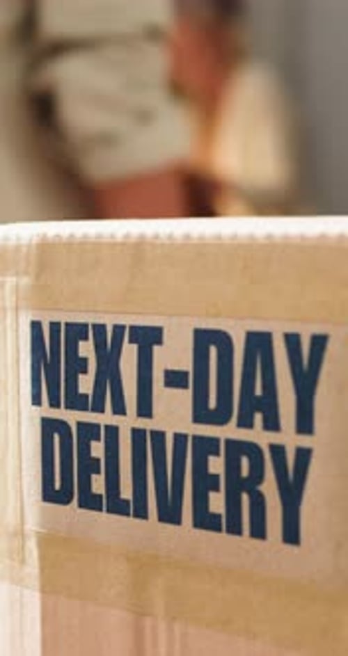 Logistics, box or shipping label in office, package distribution or rush order for next day