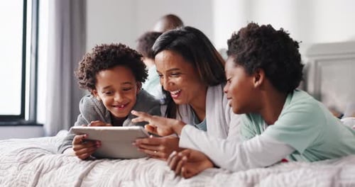 Mother, children and happy with tablet on bed for movie search, watching cartoon or app download