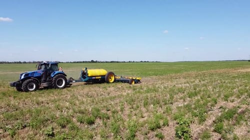 Blue Tractor O.A. Planting Canola On No Till Field