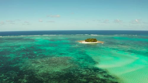 Tropical Guyam Island with a Sandy Beach and Tourists