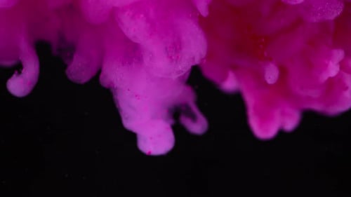 Pink Ink Dissolving Slowly in Dark Water