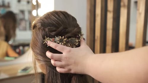 Woman Getting Elaborate Hairstyle for Wedding in Salon