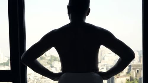 Young Man in Towel Admire View From Window at Home 30s