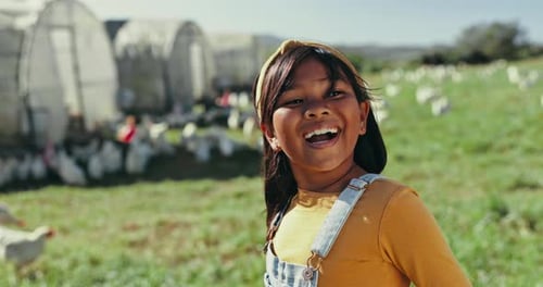 Child, laughing or girl on chicken farm for agriculture, farming or sustainable agro environment