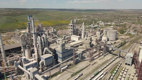 Aerial View of Cement Plant with High Concrete Factory Structure and Tower Crane at Industrial
