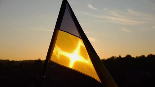 Flag Waving During Golden Sunset