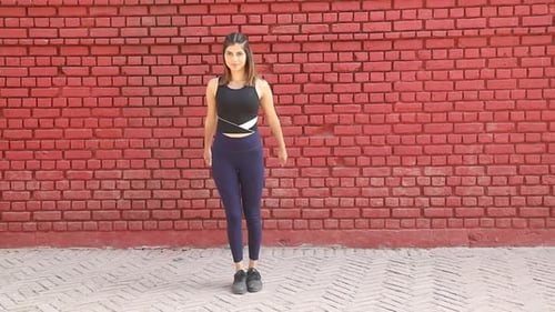 Young Woman Doing Side Kick Exercise Outdoors