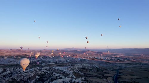 Aerial view of hot air balloons over rock formations, Turkey.