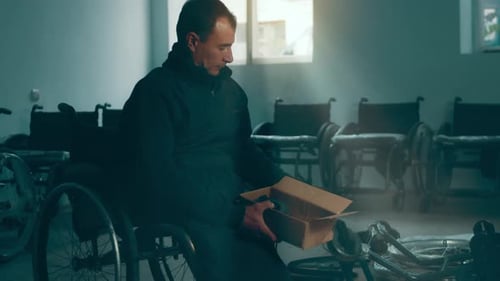 A Disabled Man Assembles a Stroller