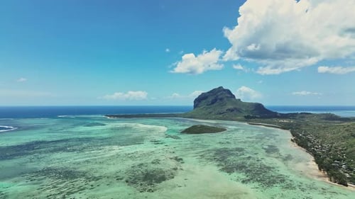 An aerial view of a tropical island in the middle of the ocean