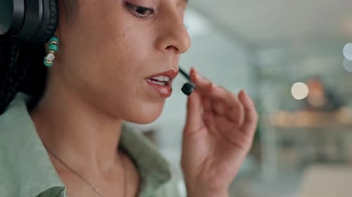 Woman, call center and mouth in consulting, customer service or telemarketing with headphones