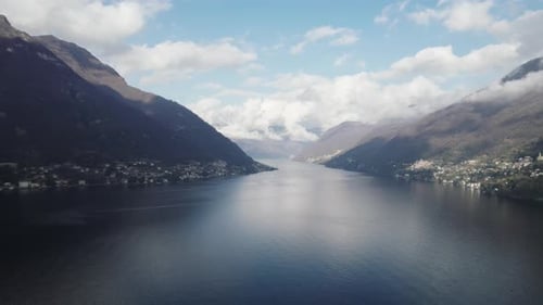 Aerial video over the famous Lake Como in Italy in a snowy winter.