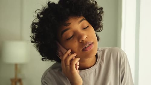 Woman Talking on Phone Inside Home