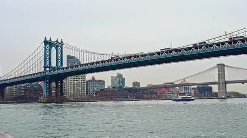 Manhattan bridge with Brooklyn city skyline in USA