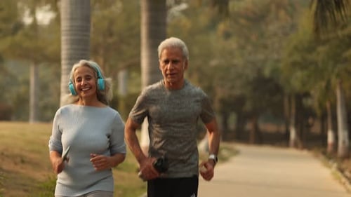 Beautiful indian Couple Jogging in the Park For Fitness And Fun
