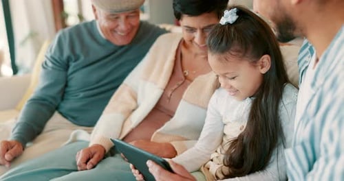 Family Together Looking at Tablet Device at Home