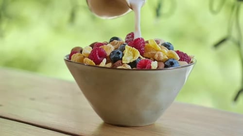 Bowl of Cereal with Fruit and Milk