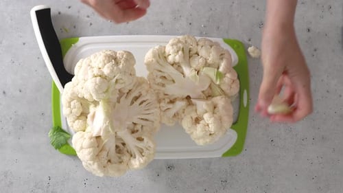 The chef devided cauliflower into florets