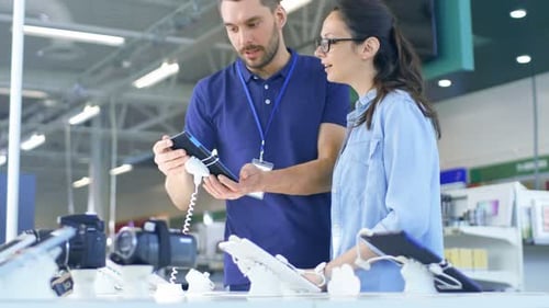 In the Electronics Store Consultant Gives Professional Advice to a Young Woman, She Considers Buyin