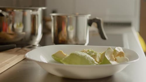 Avocado Being Drizzled with Oil in Kitchen