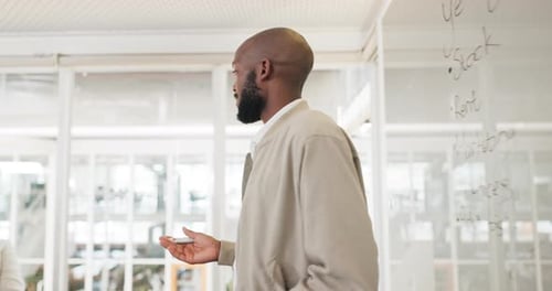 Presentation, whiteboard and meeting with a business black man talking to his team in the boardroom