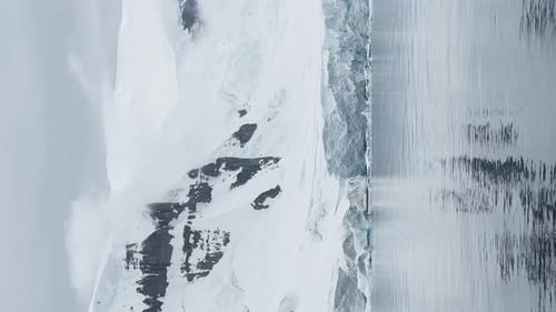 A Huge High Breakaway Glacier is Passing By in the Southern Ocean Off the Coast of Antarctica the