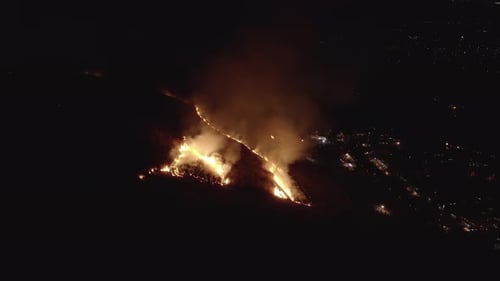 Fire on landscape at night in Nara, Japan. Wakakusa Yamayaki event Aerial 4k