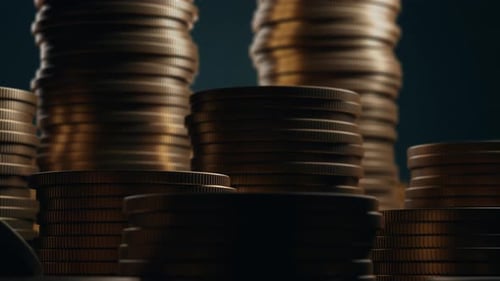 Stacks of Golden Coins on Dark Background