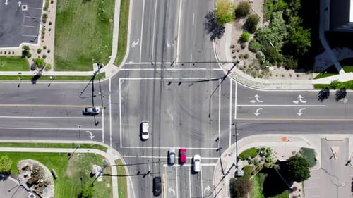 Static aerial view directly above car traffic and road intersection