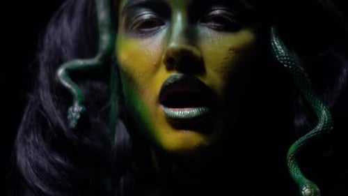 Model with Snake Makeup and Green Face Paint
