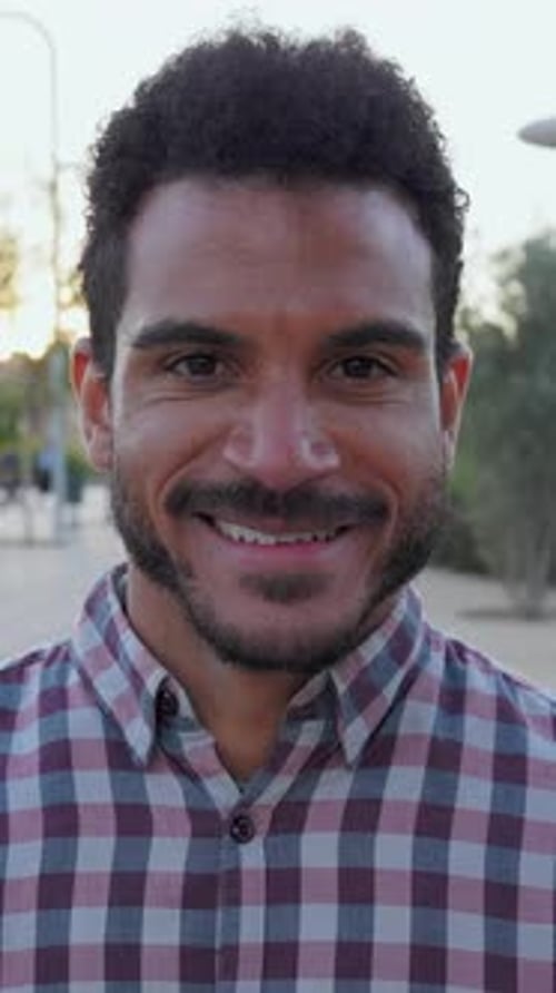 Handsome Man Smiling in a City Park