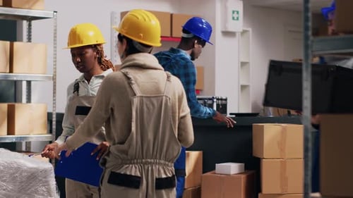 Warehouse Workers Checking Inventory in a Distribution Center