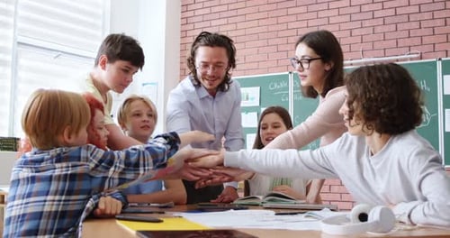 Kids and Teachers Celebrate Teamwork in Classroom