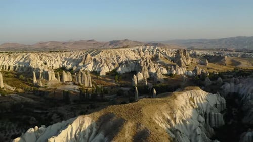 Experience Cappadocias stunning rock formations at sunset
