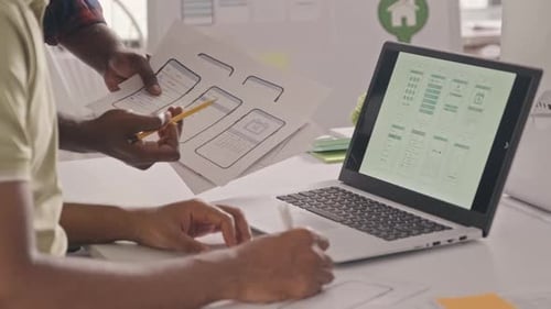 UX Designers Developing Mobile App in Office