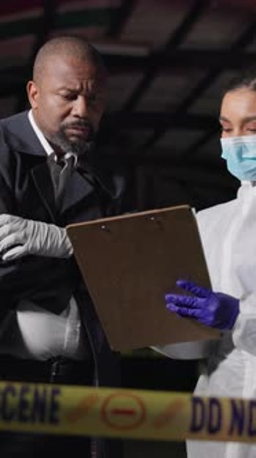 Investigators Discussing Crime Scene at Night