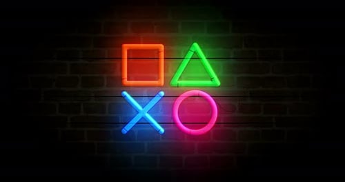 Íconos del joystick reproducen Vídeo bucle de neón sobre pared de ladrillo