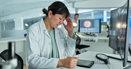Stressed Scientist Working in Modern Laboratory