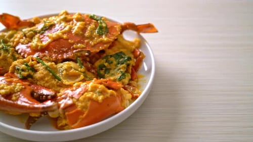 Close-Up of Crab with Yellow Sauce on Plate
