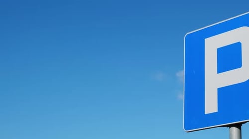 Blue Parking Sign Under Clear Sky