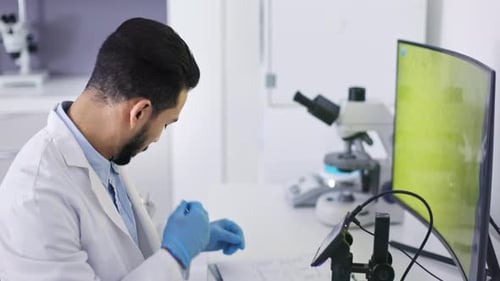 Scientist Working in Modern White Lab