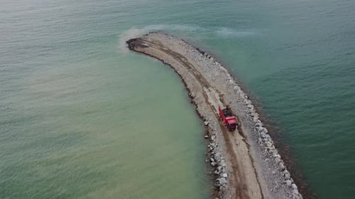 Truck Engineering Coastal Barrier Aerial. Coastal Barrier Building Process