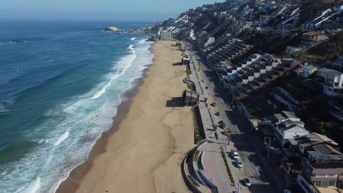 AERIAL: city beach shore in sunny day.